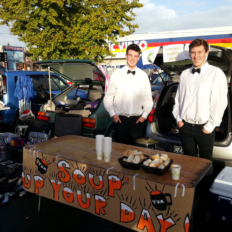 Stallholders chatting over early-morning coffee.