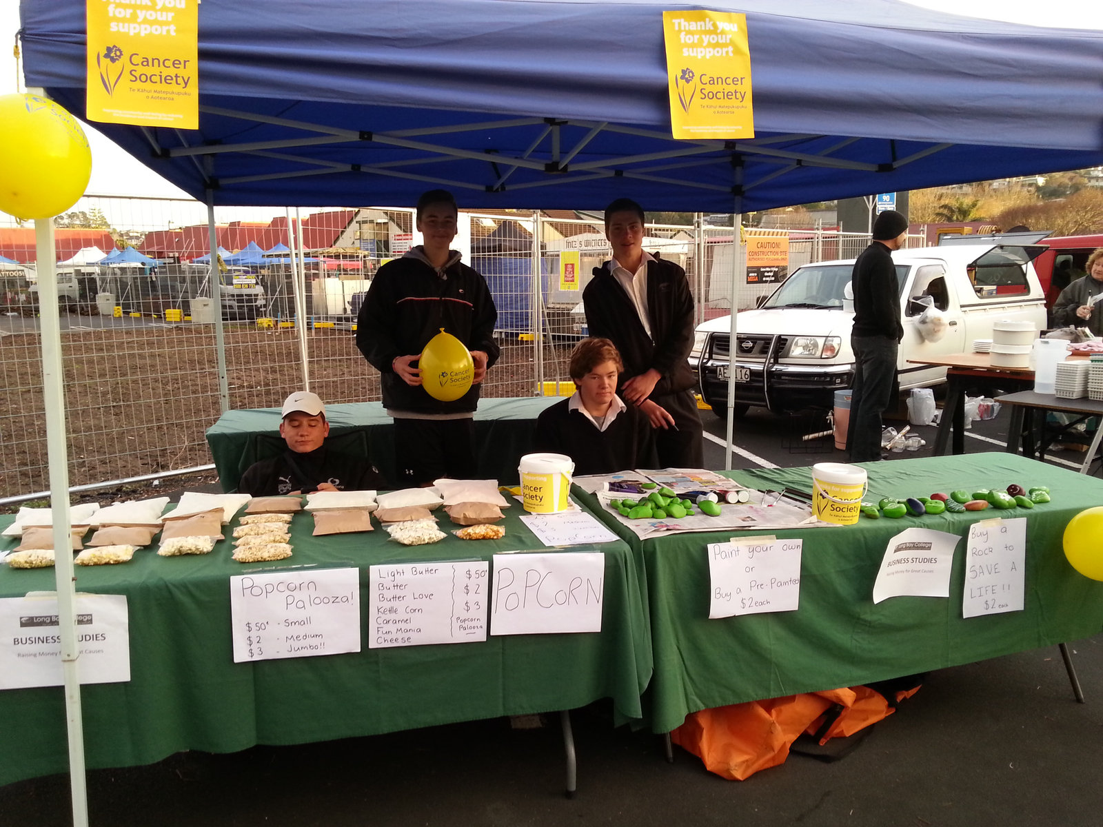 Coastguard North Shore volunteers greet arriving stallholders before sunrise.