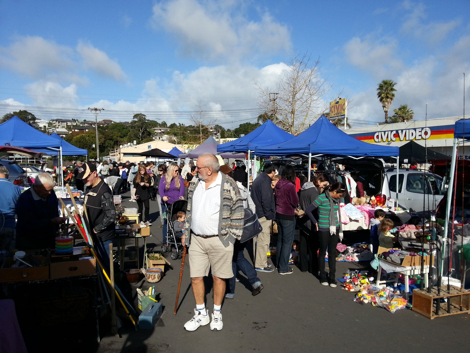 Shoppers browse stalls of handcrafted goods at Browns Bay Sunday Market.
